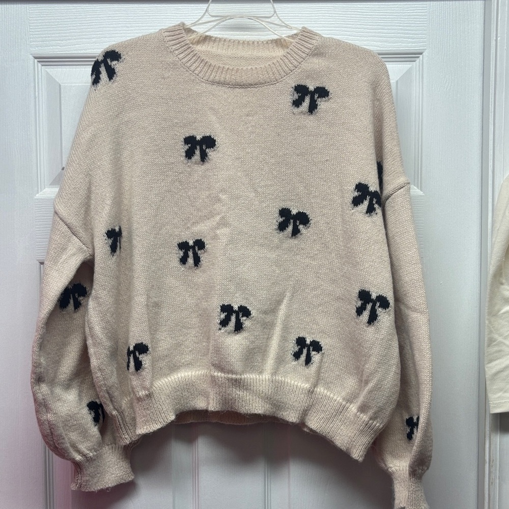 Women's Cream Sweater with Black Bow Accents